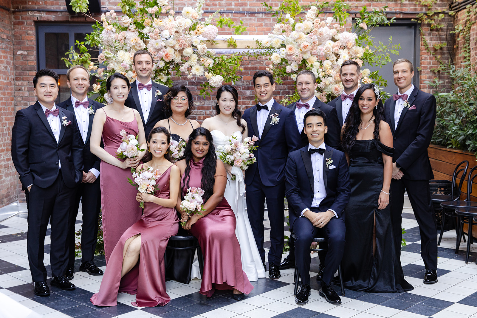 Bride and Groom with Wedding Party at Wythe Hotel Garden Terrace