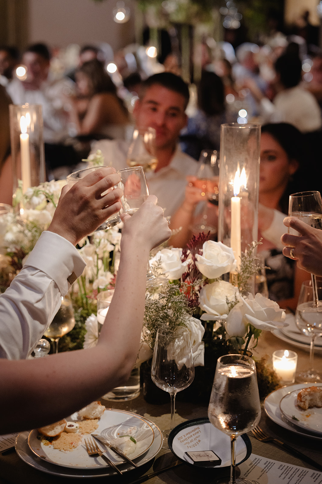 Guests Clinking Glasses at Wave Hill Garden Wedding Reception