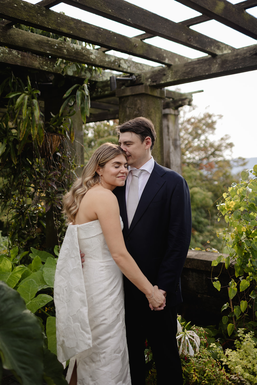 Bride and Groom Embrace During First Look at Wave Hill Garden