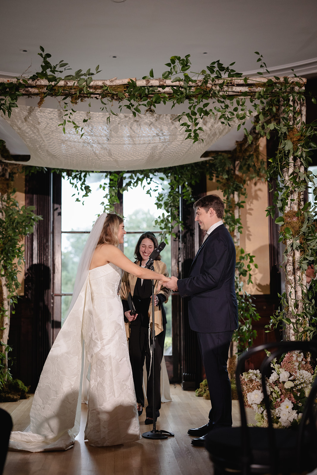 Couple Exchanging Vows Under Chuppah at Wave Hill Garden