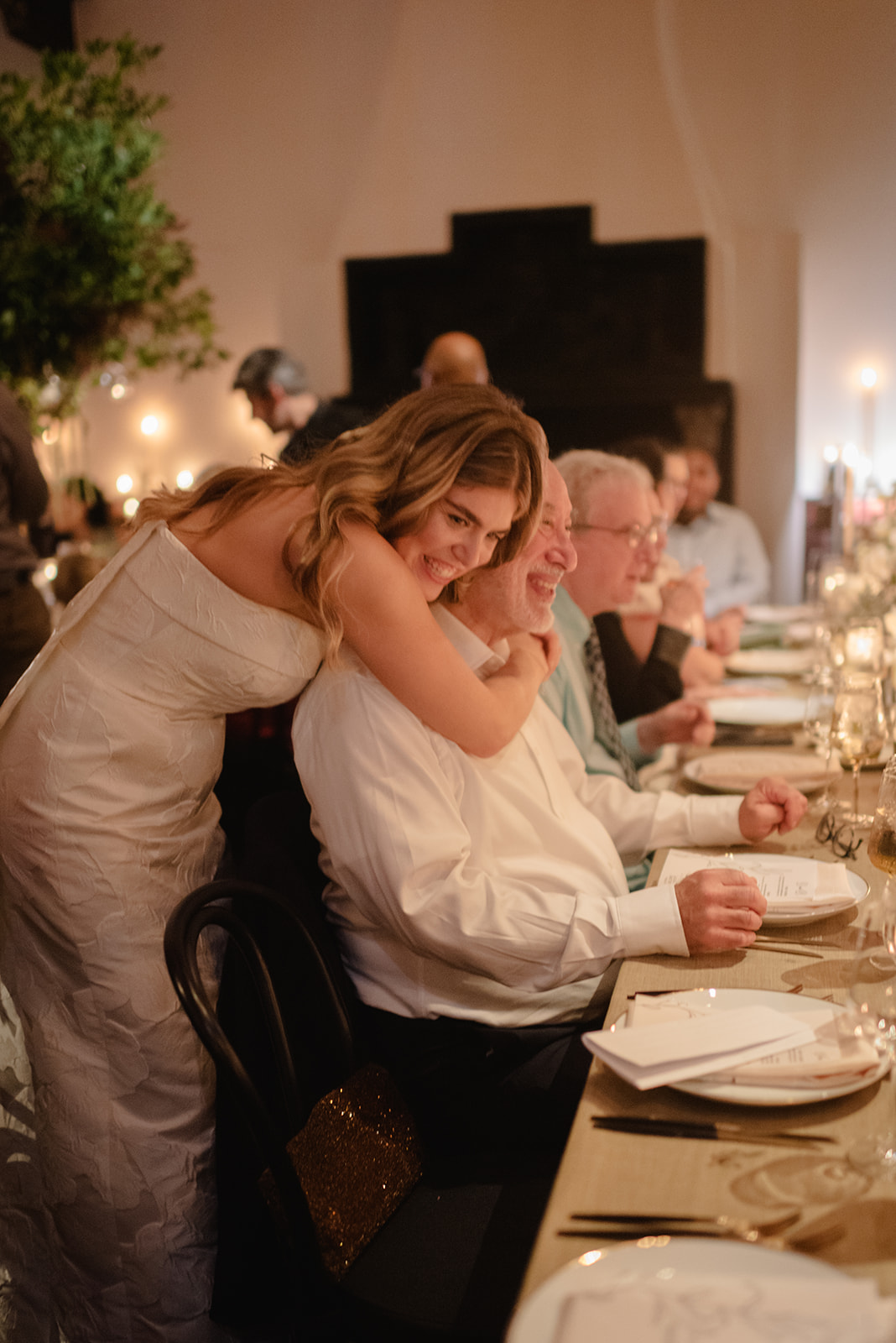 Bride Embracing Guest at Wave Hill Garden Wedding